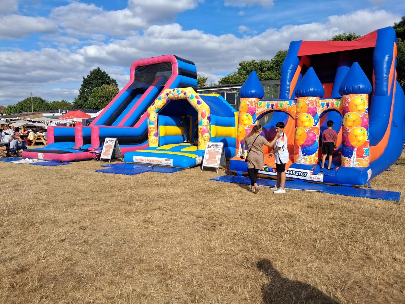 Bounce Central castles and slide at a community event