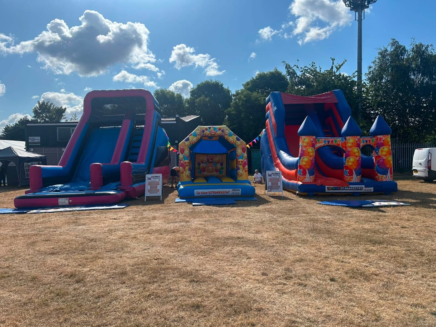 Inflatables lined up at a school fair