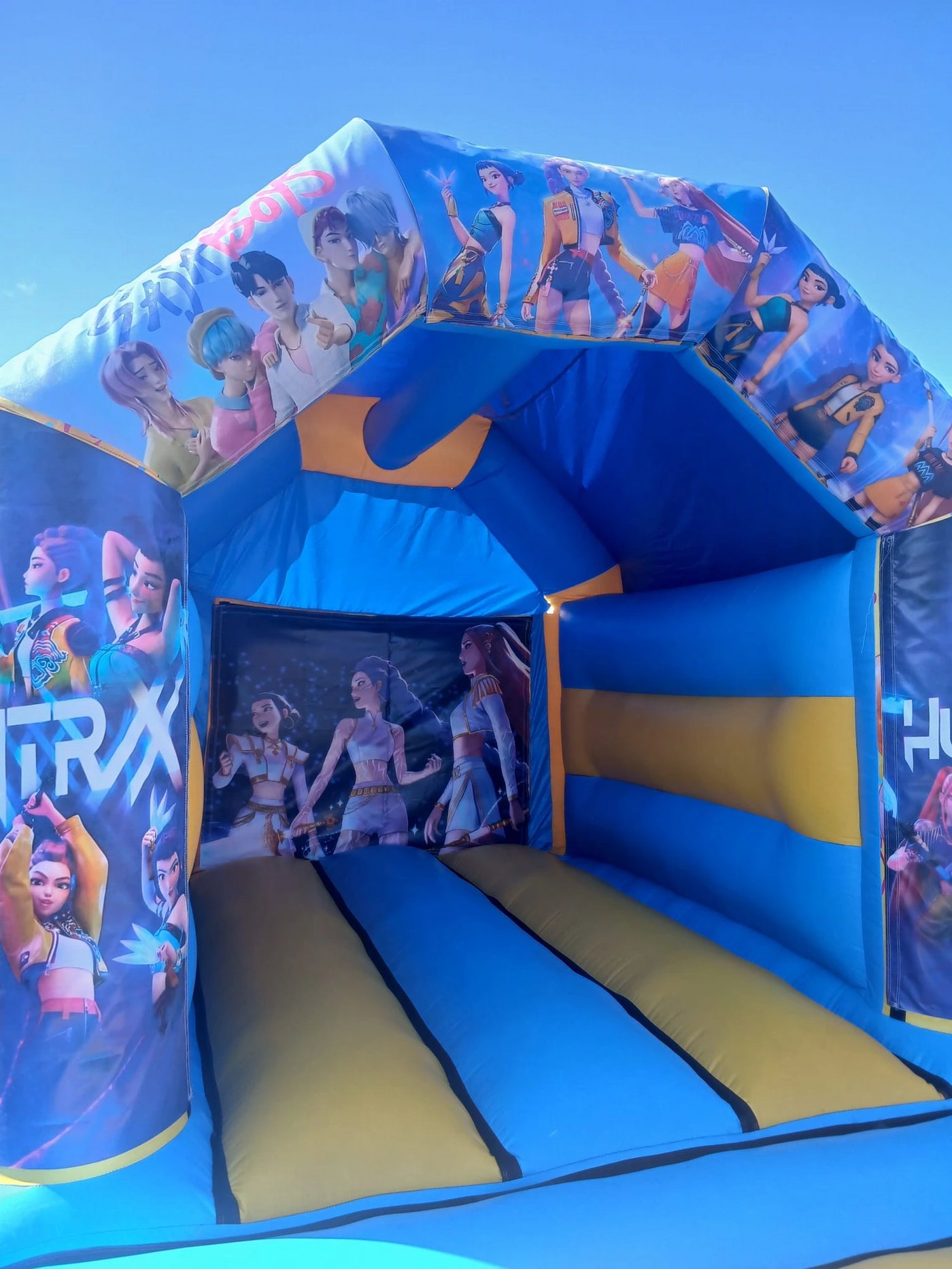 K-Pop bouncy castle with HUNTR/X artwork