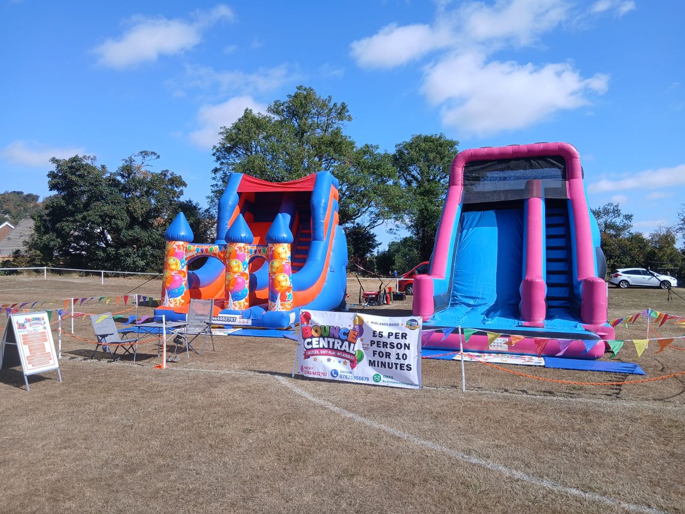 Giant inflatable slide with 12ft platform at a fun day